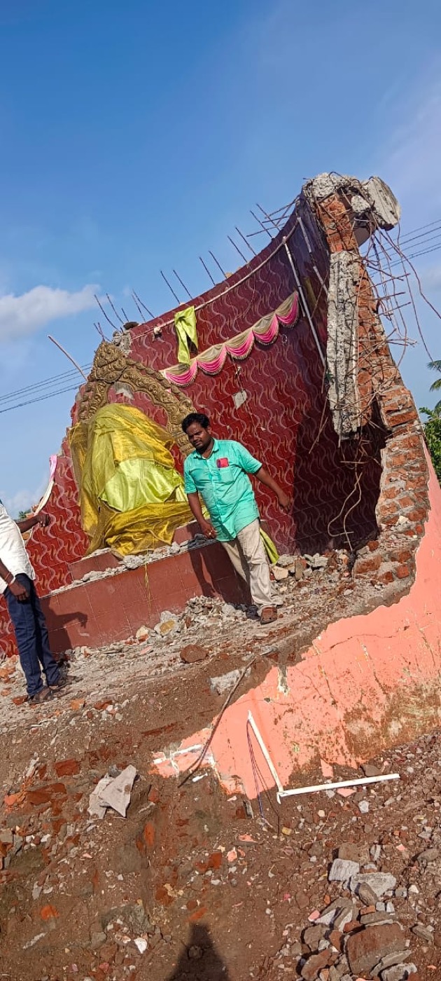 Damaged temple structure after demolition